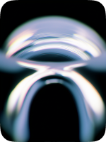 Close-up of a transparent, curved glass object reflecting light against a dark background.
